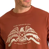 Remera color ladrillo de corte clásico con estampado de águila con texto en blanco.