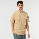 Camiseta lisa de corte oversize y cuello redondo en color beige.