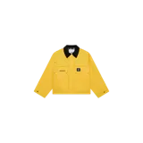 Campera de corte boxy de Eme Studios, color amarillo encerado, con cuello negro de terciopelo, cierre frontal oculto y bolsillos frontales con solapa.