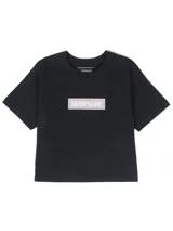 Remera corta de jersey de algodón negro, con cuello redondo de rib y estampa frontal de caja con logo reflectante de Caterpillar.