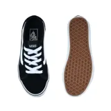 Championes Vans Filmore Decon negros con la franja lateral blanca y cordones blancos.