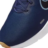 Championes de running Nike Downshifter 12, color negro con detalles en rojo y suela blanca. Presentan el logo de la marca en el lateral y un diseño ligero y transpirable.