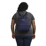 Mochila JanSport azul marino con cierre tipo bolsa, tirantes ajustables y bolsillo frontal con cierre.