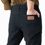 Pantalón de jean negro Wrangler modelo Texas Slim, de corte ajustado.