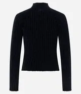 Blusa cropped de punto chenille color negro, con cuello alto y mangas largas raglán. Presenta una textura acanalada y pequeños puntos brillantes aplicados en el frente.