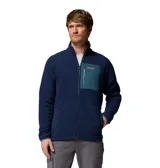 Campera polar de cuello alto con cierre frontal completo. Presenta un bolsillo en el pecho con cierre y revestimiento de nailon en contraste, además de bolsillos laterales. El diseño incluye puños y dobladillo con ribete elástico para mayor ajuste.