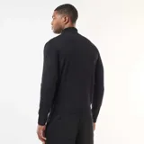 Sweater de cuello alto liso, de manga larga con puños y ruedo acanalados.