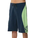 Boardshort Rip Curl Sseries Panel Cordura de 22", color azul marino con paneles laterales en verde claro, cordón ajustable en la cintura y estampa en la pierna izquierda.