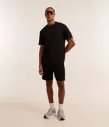 Remera deportiva Get Over de color azul marino, confeccionada en tech fleece con tecnología dry de secado rápido, cuello redondo y manga corta, de corte holgado.