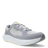 Championes Under Armour modelo Versurge, color gris con detalles en amarillo neón. Confeccionados con una combinación de malla textil y revestimientos de gamuza sintética. Cuentan con entresuela Charged Cushioning para mayor amortiguación y suela de goma para tracción.