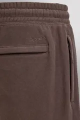 Pantalón jogger relaxed fit de Zara Athleticz confeccionado en tejido de algodón color marrón, con cintura elástica ajustable mediante cordón en contraste, bolsillos laterales y bajo con puño elástico.