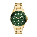 Reloj Fossil de estilo diver con caja y pulsera de acero inoxidable en tono dorado. Presenta una esfera verde con índices luminiscentes, ventana de calendario y bisel giratorio unidireccional a juego.