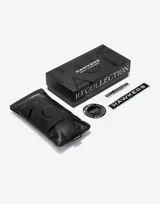 Lentes de sol unisex Hawkers modelo La Noire Eco, con montura carey y lentes color naranja.