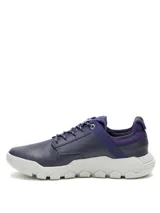 Sneaker Caterpillar modelo Hex Lite, color azul, confeccionada en cuero con detalles textiles. Presenta suela de EVA blanca con diseño hexagonal, cierre mediante cordones y logo de la marca en el lateral.