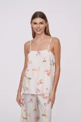 Blusa de viscosa con breteles finos, diseño holgado y estampado veraniego con motivos marinos y frutales.
