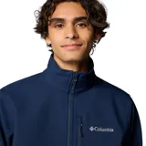 Chaqueta Columbia modelo Ascender Soft Shell, color azul marino, con cuello alto, cierre frontal completo, bolsillo en el pecho y bolsillos laterales con cierre. Presenta puños ajustables y logo de la marca bordado en el pecho.