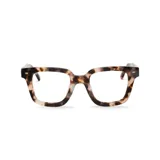 Anteojos de acetato con forma cuadrada y diseño carey en tonos marrón, beige y negro.