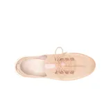 Championes de tejido knit color beige, con diseño ergonómico, cordones al tono y suela blanca flexible. Cuenta con tecnología de amortiguación en el talón y plantilla elástica.