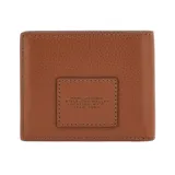 Billetera Marc Jacobs modelo The Billfold, de cuero texturizado color negro, con diseño plegable y el texto 'THE WALLET' impreso en la parte frontal junto con la marca.