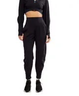 Pantalón de jogging negro de corte holgado, con cintura alta y bolsillos laterales.