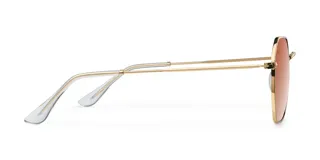 Lentes de sol con armazón octogonal dorado de acero inoxidable y lentes marrones polarizadas.