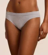 Kit de tres bombachas modelo bikini confeccionadas en tejido texturizado con tecnología seamless sin costuras. El set incluye una unidad en color blanco, una en gris melange y una en negro.