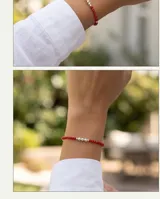 Pulsera de cuentas de cristal rojo con detalle central de esferas de plata 925.