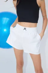 Bóxer confeccionado en poplín de algodón con cintura elástica ancha y logo doble R bordado en la parte delantera.