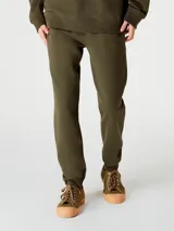 Pantalón deportivo tipo babucha de corte ajustado, con cintura elástica con cordón de ajuste y puños acanalados en los tobillos.
