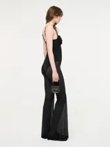 Mono negro de Diesel con corset y transparencias en las piernas. Breteles finos regulables y cierre en la espalda.