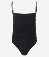 Body de tul color negro con breteles finos ajustables, escote redondeado y detalle de fruncidos laterales. Marca Blue Steel.