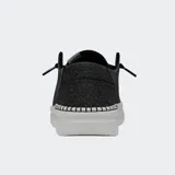 Zapatos Hey Dude modelo Wendy Rise, de lona color negro con detalles brillantes, suela de plataforma blanca y cordones elásticos.