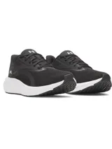 Championes de running Under Armour modelo W Ascend para mujer, de color negro con suela blanca. Cuentan con capellada de malla transpirable, amortiguación Charged+ y logo de la marca en el lateral y talón.