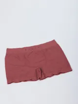 Boxer blanco con elástico negro en la cintura con el logo de la marca Rusty en gris.