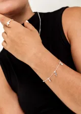 Pulsera de plata 925 con cadena groumet, dije de cruz y puntos de luz con zirconia.