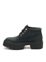 Bota Caterpillar modelo Colorado Max Chukka, color negro con detalles en dorado y suela chunky de goma con plataforma.