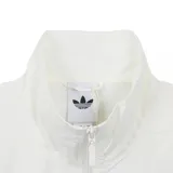 Campera deportiva Adidas con diseño color block en blanco, negro y verde. Presenta cuello alto, cierre frontal completo y las icónicas tres tiras de la marca en los laterales en color verde. El logo de Adidas está bordado en el pecho.