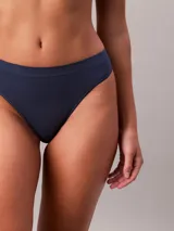 Colaless de microfibra elástica color azul marino, con logo de Calvin Klein en relieve y bordes limpios.