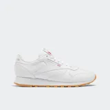 Championes Reebok Classic Leather de diseño retro y minimalista, con parte superior de cuero blanco, entresuela de EVA y suela de goma color caramelo.