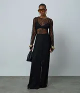 Vestido midi de encaje negro con transparencias, cuello redondo y manga larga, de la marca Blue Steel.