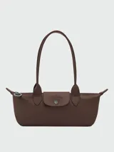 Cartera de hombro pequeña Longchamp Le Pliage Xtra, de diseño estructurado en color marrón oscuro, con asas de hombro y cierre superior.