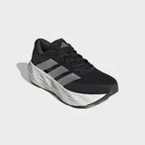 Championes de running Adidas Galaxy 8, de color negro con las tres tiras plateadas en el lateral y una suela gruesa de amortiguación blanca.