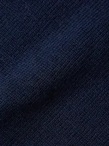 Sweater Tommy Hilfiger azul marino de tejido de punto con cuello redondo y logo bordado en el pecho.