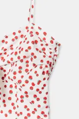 Vestido midi de popelina blanco con estampado de lunares rojos, escote corazón, tirantes finos con lazo y detalle de nudo en el busto.