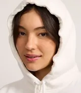 Saco cerrado tipo hoodie blanco con capucha, cordón ajustable, bolsillo canguro y estampa frontal con el texto "SEATTLE Washington 1989".