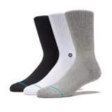 Pack de tres pares de medias de caña media Stance, confeccionadas en tejido acanalado. Incluye un par negro, uno blanco y uno gris jaspeado, todos con detalle de línea turquesa en la puntera y logo de la marca.
