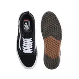 Championes Vans modelo Skate Old Skool con tecnología Wafflecup, color negro con detalles en blanco. Presentan una combinación de materiales en la capellada, cordones blancos, la icónica banda lateral de Vans y una suela de goma resistente con diseño de waffle.
