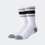 Medias de caña media Stance modelo Boyd, color blanco con franjas horizontales en gris y negro en la parte superior. Presentan puntera y talón reforzados en color gris jaspeado con un detalle de línea turquesa.