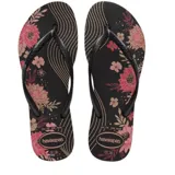 Sandalias tipo ojotas Havaianas modelo Slim Organic, con base negra y estampado floral en tonos rosados y dorados. Presentan tiras finas de color negro con el logo de la marca en relieve.