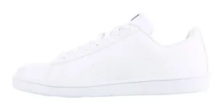 Championes Puma modelo Up, de estilo urbano y diseño clásico. Presentan una capellada de cuero sintético en color negro con la icónica franja lateral de la marca en color blanco y suela de goma blanca.